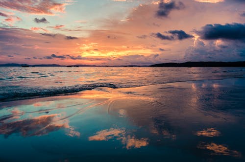 Reflection of the sky on the beach